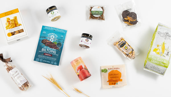an array of California snacks including tapenade, sea salt caramels, California gummy bears, dried fruit and almonds.
