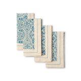 Set of 4 “Motifs Fog” embellish napkins, 18″×18″, hand block printed cotton, overlapped to show blue floral design.