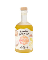 A glass bottle of Roasted Garlic Oil with Yuzu & Miso, wood cap, and illustrated label of garlic and lemon.