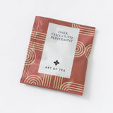 A brown Dark Chocolate Peppermint Eco Teabag Sachet with a biodegradable teabag on a white background.