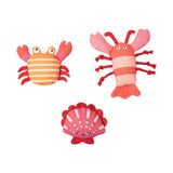 Current Obsession Dog Toy: Set of 3 plush sea creatures—crab, lobster, clam—made from durable canvas with cute faces.