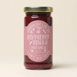 A jar of Raspberry & Tango Tangerine Marmalade from Ojai, California with a pink label and gold lid.