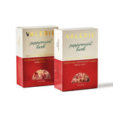 Two boxes of Handmade Peppermint Bark, featuring dark and white chocolate with dried mint, are shown side by side.