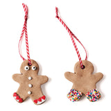 Two gingerbread ornaments made with the Gingerbread Ornament DIY Craft Kit—one with hearts, one with sprinkles.