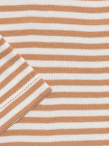 Close-up of the Organic Ginger Stripe Baby Bodysuit showing beige and white stripes, a seam, and a folded corner.