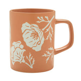 The Poppy Ceramic Mug is a matte orange ceramic mug with white poppies, microwave and dishwasher safe.