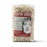 A clear 16 oz bag of Rancho Gordo White Heirloom Beans, filled with creamy white beans. The vintage-style label features an illustration and text describing these Italian-grown heirloom beans.