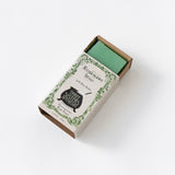 Soap box open revealing green soap