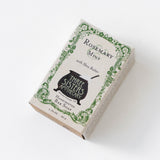 The Herbal Riviera Gift Set includes Rosemary Mint soap with shea butter, adorned with a green border and black cauldron logo—ideal to pair with a lavender candle or slip into a natural gift pouch.