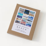 A brown box labeled Santa Barbara Beach Images Boxed Note Cards with watercolor ocean and coastal scene covers.