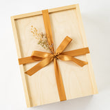 Santa Barbara Company Wood Gift box tied with gold ribbon