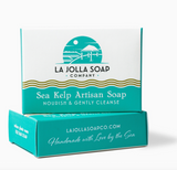 Two turquoise handmade soap boxes labeled La Jolla Soap Company Sea Clay Artisan Soap with ocean-themed design.
