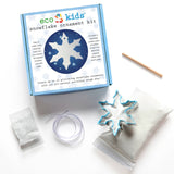 Snowflake Ornament DIY Craft Kit includes dough mix, snowflake cutter, ribbon, stick, and glitter for holiday crafts.