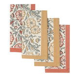 Four Bloom Sienna napkins, hand block printed, folded with tan and rust borders, arranged in an overlapping pattern.