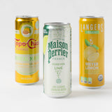 Three cans of Citrus Sparkling Water—mango, lime & Meyer lemon—perfect for a Perrier welcome gift order.