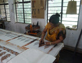 photo showing woman hand block-printing in india