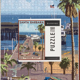 A finished 1000 Piece Santa Barbara Stern's Wharf Puzzle with the box displayed on top of the completed puzzle.