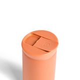 Ceramic Coated Travel Mug in Terracotta with matte finish and sliding lid, displayed on a white background.