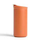 Ceramic Coated Travel Mug in Terracotta stands upright, closed spout, “CREATED” on side, on a white background.