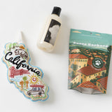 Three items: a California patch, Lavande Lavender Dog Shampoo, and Santa Barbara dog treats on white background.