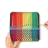 Hands weaving rainbow cotton loops on a 10 inch metal PRO potholder loom with a weaving hook