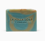 Blue and tan Sea Clay Artisan Soap by La Jolla Soap Company with logo engraved on the front.