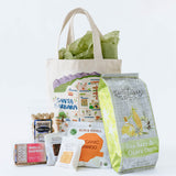 Tote bag with various organic products on a white background
