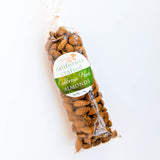 A clear plastic bag tied at the top, filled with whole, vegan gluten-free almonds in their shells. The bag features a green and white label reading "California Herb Almonds.