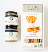 Crackers & Spreads pairs two jars of Santa Barbara Company tapenades—Artichoke Parmesan and Kalamata & Caper—with Organic Sourdough Flatbread Crackers with olive oil & sel gris from Rustic Bakery.