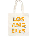 The Los Angeles Font Tote is a beige canvas bag with “LOS ANGELES” in bold orange and simple line art of LA icons.