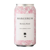 A Margerum Santa Barbara County Riviera Rosé Can with a white label, pink floral pattern, black text, and a small black palm tree—a refreshing rosé from Santa Barbara County.