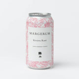 A white can with pink floral designs and a black palm tree displays the label Margerum Santa Barbara County Riviera Rosé Can from Margerum Wine Company.
