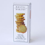 A 4 oz (112g) white box of Meyer Lemon Shortbread Cookies, made with organic wheat flour, features a stack of golden cookies and black text on the front.
