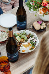 Alma Rosa wine being enjoyed at a gathering