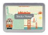 San Francisco Sticky Notes come in a metal tin featuring city-themed designs: the Golden Gate Bridge, cable car, Coit Tower, a crab, and skyline. Perfect for home office reminders. The label reads "Sticky Notes.