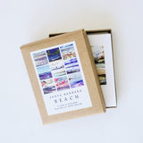 Santa Barbara Beach Images Boxed Note Cards with envelopes, featuring colorful beach art, partially open on white background.