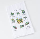 The Santa Barbara Olive Oil & Vinegar Gift Box includes a white tea towel labeled Santa Barbara Cooks, featuring colorful olive oil variety illustrations and a central countryside scene from Santa Barbara County.