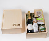 SheerID Anniversary Gift Box: champagne, organic popcorn, chocolate, herb almonds & SheerID logo on the lid.
