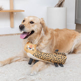 Golden retriever on a rug, happy with mouth open, playing with I’ve Been Spotted Earth Friendly Dog Toy.