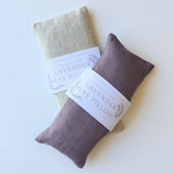 Two Lavender Linen Eye Pillows, beige and lavender, with product labels shown on a white background.