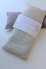 Two Lavender Linen Eye Pillows, filled with organic flaxseed, in beige and lavender.