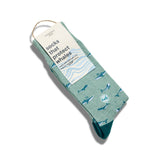Socks that Protect Whales folded with a Conscious Step paper label
