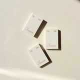 Three small Matchbox Tis The Season party favors arranged on a light background.