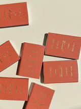 Red rectangular Matchbox Wonderful Time of the Year party favors printed with It’s the most wonderful time of the year.