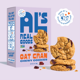 A box of Chewy Oat Cranberry Cookies with cookies and cranberries stacked in front.