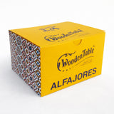 Yellow box labeled No Gluten Traditional Alfajor XL (GRAB & GO) with patterned sides, filled with dulce de leche.