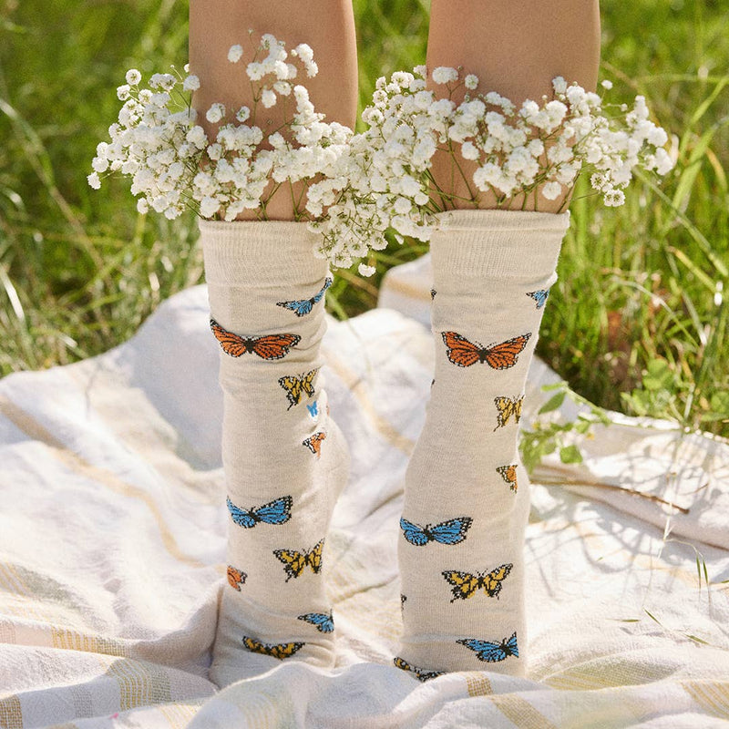 butterfly socks worn and shown with flowers