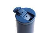 Ceramic Coated Travel Mug in Pacific Blue with flip-top, leak-proof lid, viewed from above on a white background.