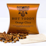 Orange Clove Hot Toddy Kit box with whiskey spices, cinnamon sticks, and a spice bag displayed in front.