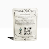 White pouch for Chocolate Covered Dates | Peanut Butter shows ingredients, nutrition, certifications, and back QR code.